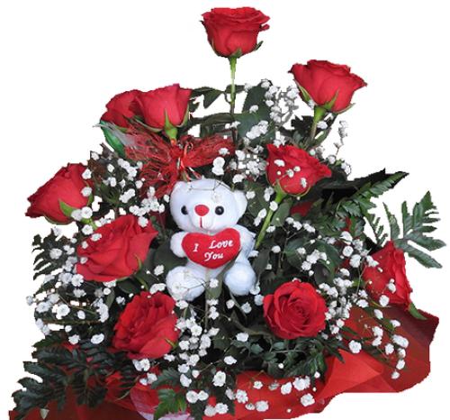 Αληθινή Αγάπη Σύνθεση με κόκκινα τριαντάφυλλα, πρασινάδα και αρκουδάκι.