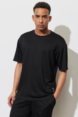 AC&Co / Altınyıldız Classics Men's Black Loose Fit Crew Neck Short Sleeved Soft Textured Sports T-Shirt.