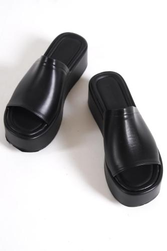 Capone Outfitters Capone Sole Womens Black Wedge Heels with a thick strap and heel.